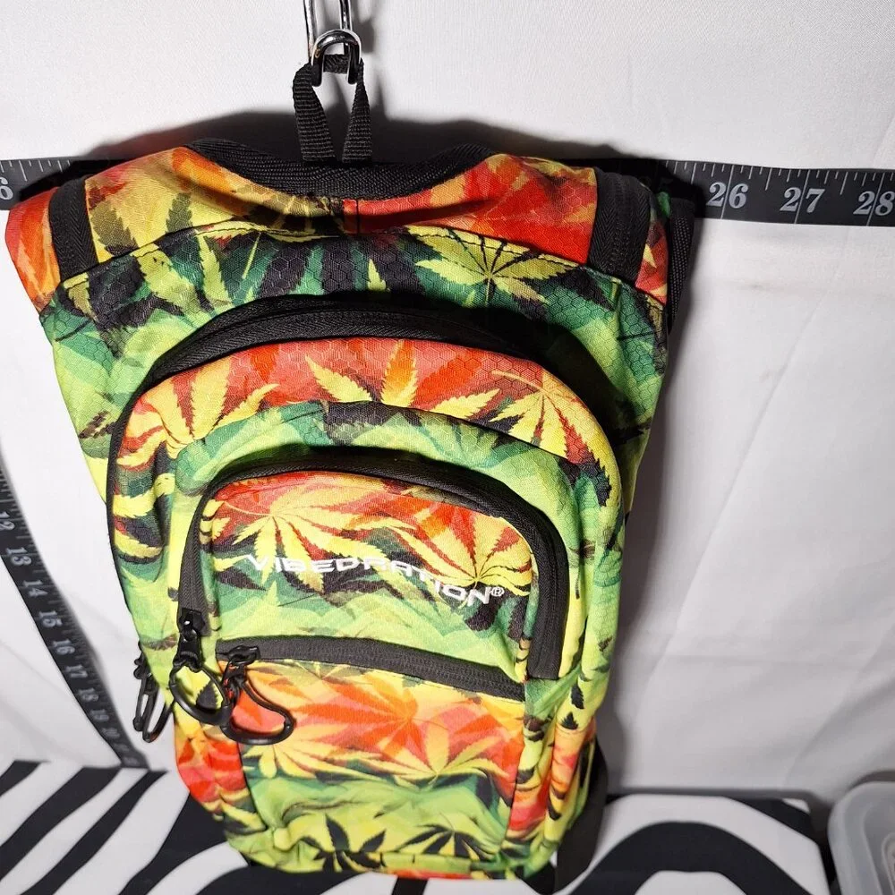 Vibedration Hydration Backpack w/o bladder - green, orange, black leaves - used